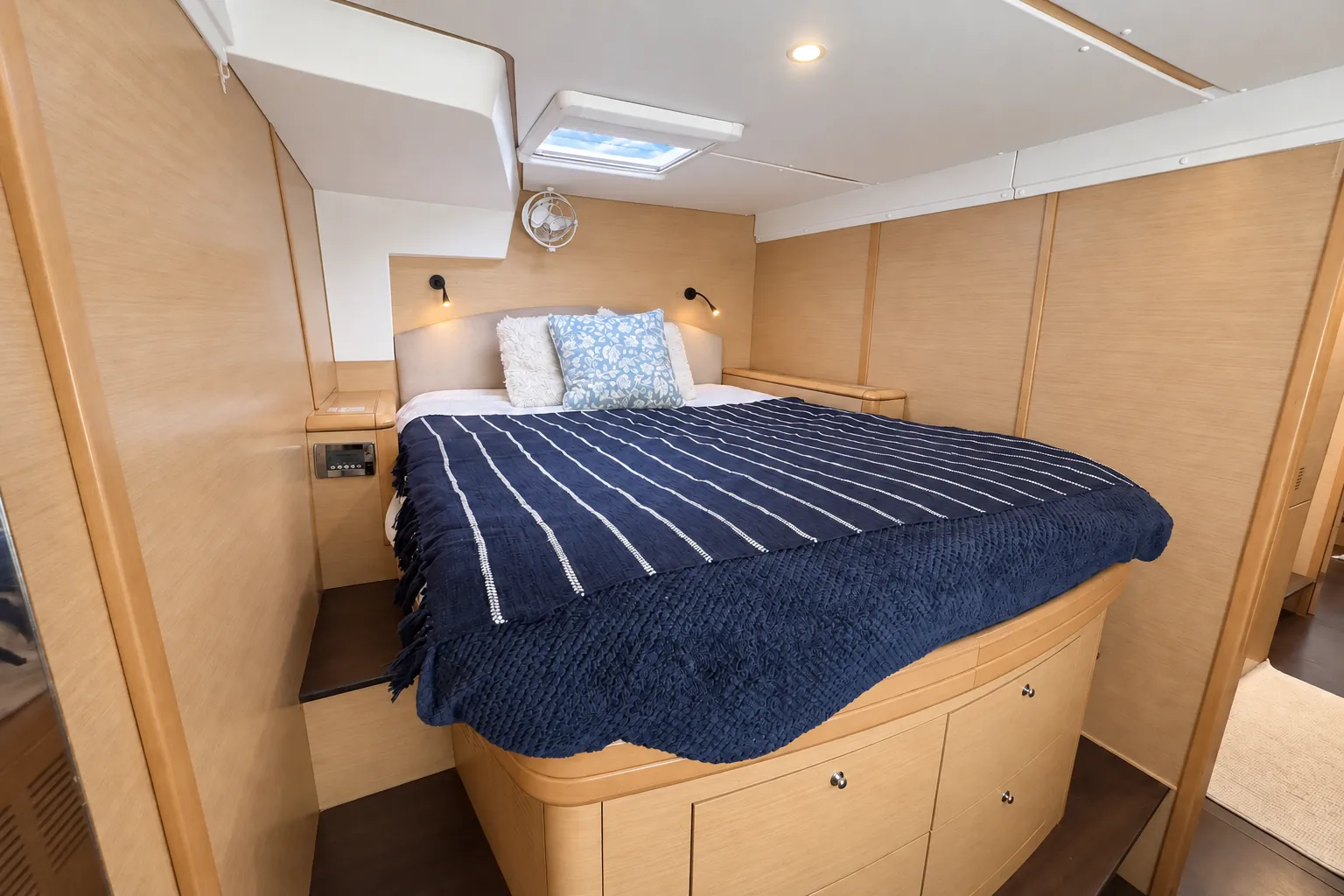 Lagoon 500 cabin with a navy striped throw