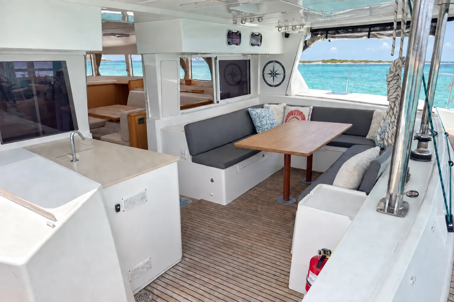 Lagoon 500 cockpit dining table looking out over the anchorage