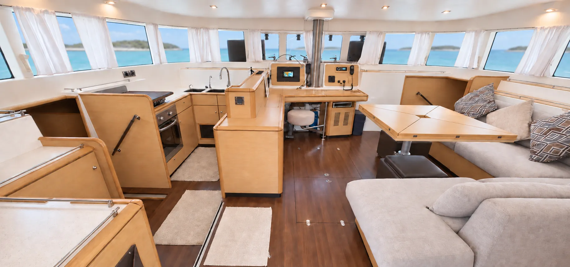 Lagoon 500 salon and galley with wraparound windows onto the Exumas